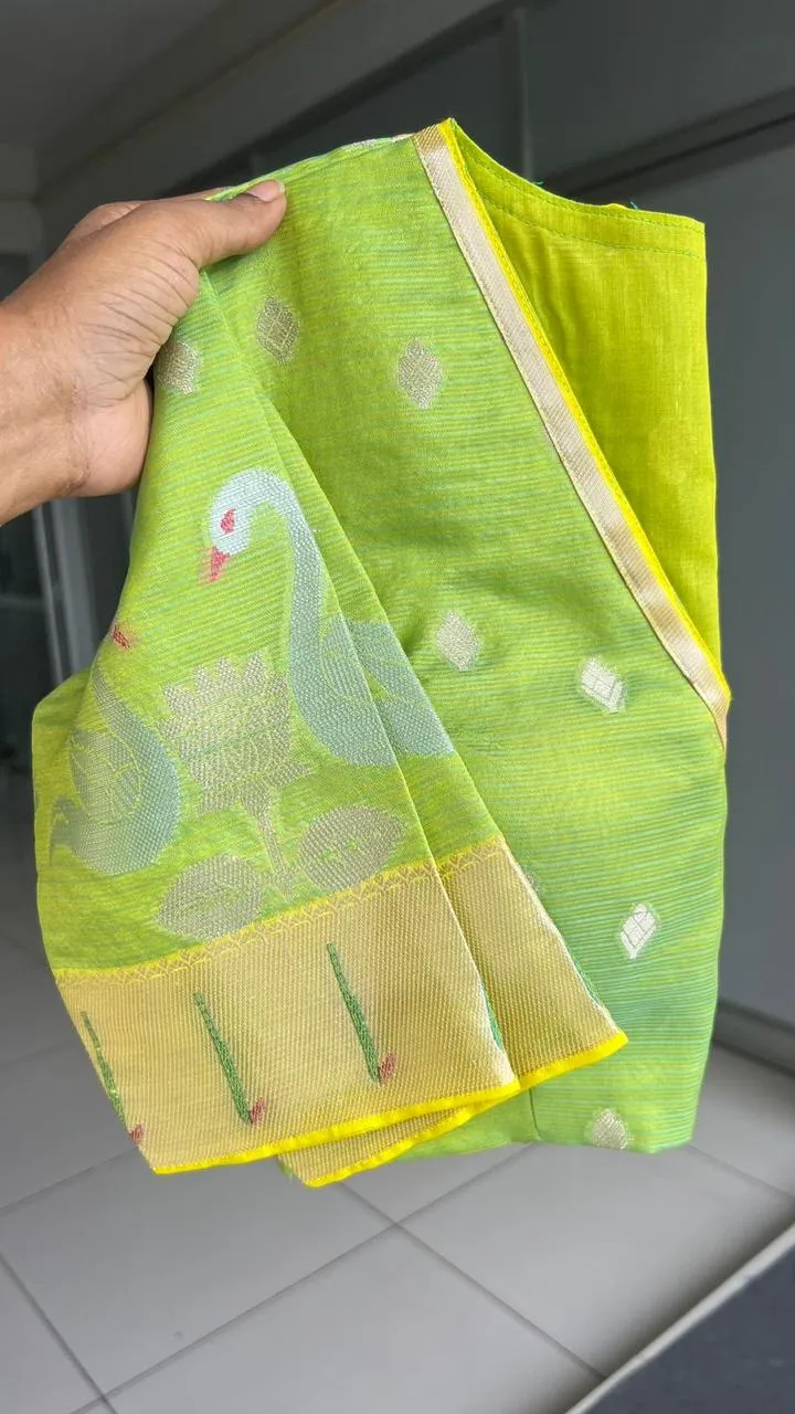 Sea green kota embroidery saree with parrot blouse