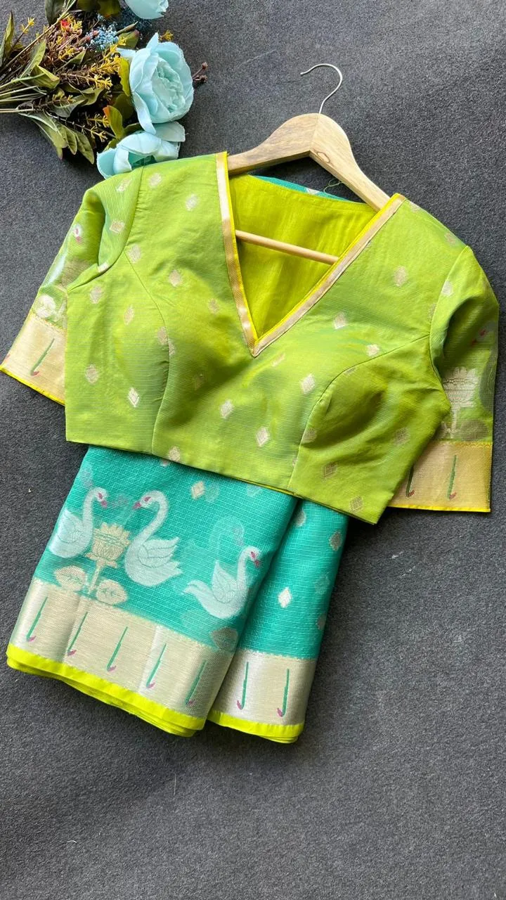 Sea green kota embroidery saree with parrot blouse